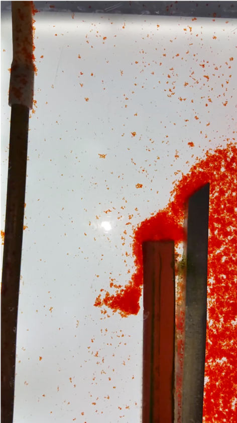 Floc hopper detail with flocs "spilling" over the wall (click to be sent to video).
